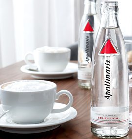 Apollinaris mineral water and a cup of coffee